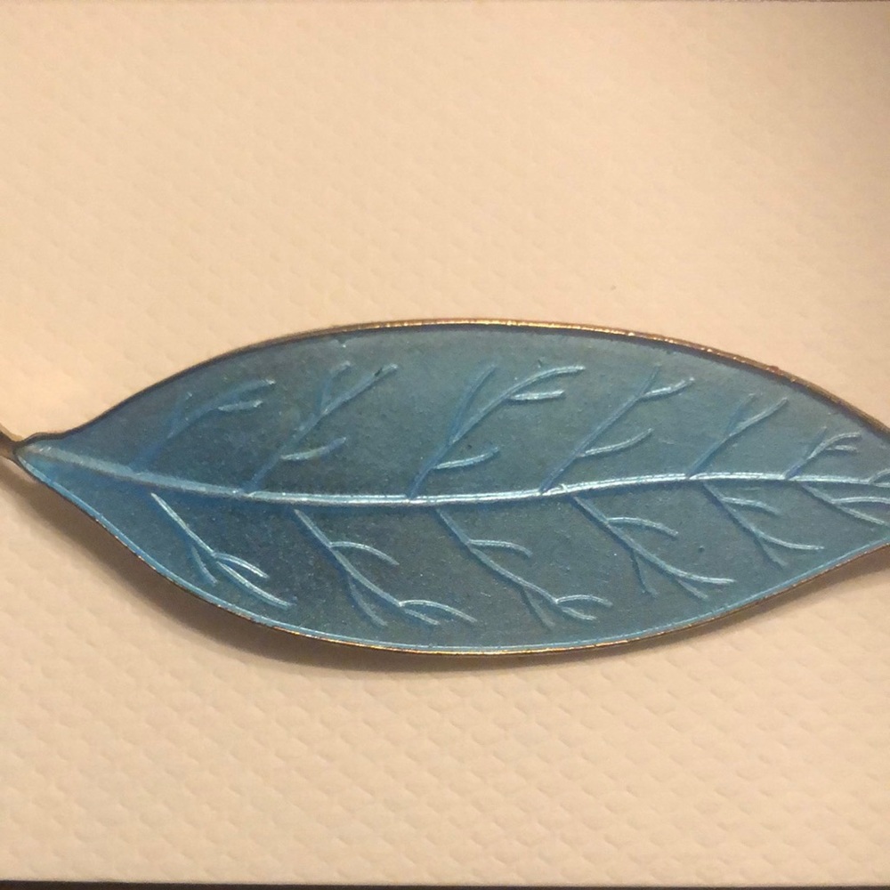 Vintage blue enamel leaf with gold tone stem.